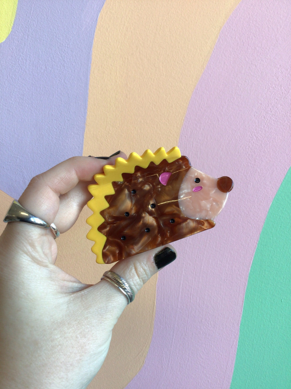 Yellow hedgehog-style animal hair claw with pink nose and glossy finish