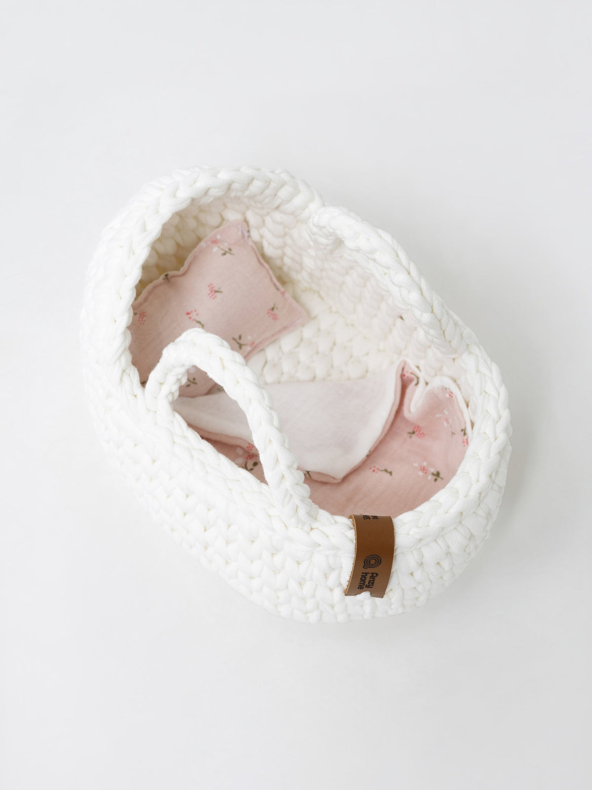 Knitted mini moses basket with rocking stand and pink floral inner liner
