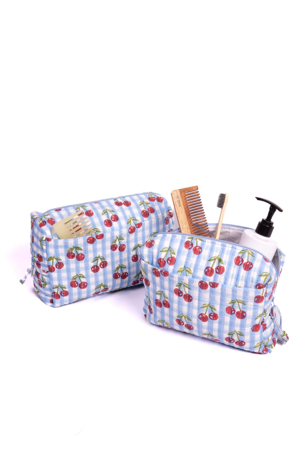 Set of two zippered makeup bags with cherry print on blue check fabric