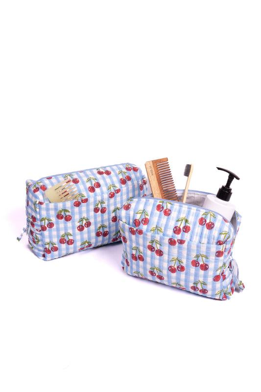 Set of two zippered makeup bags with cherry print on blue check fabric