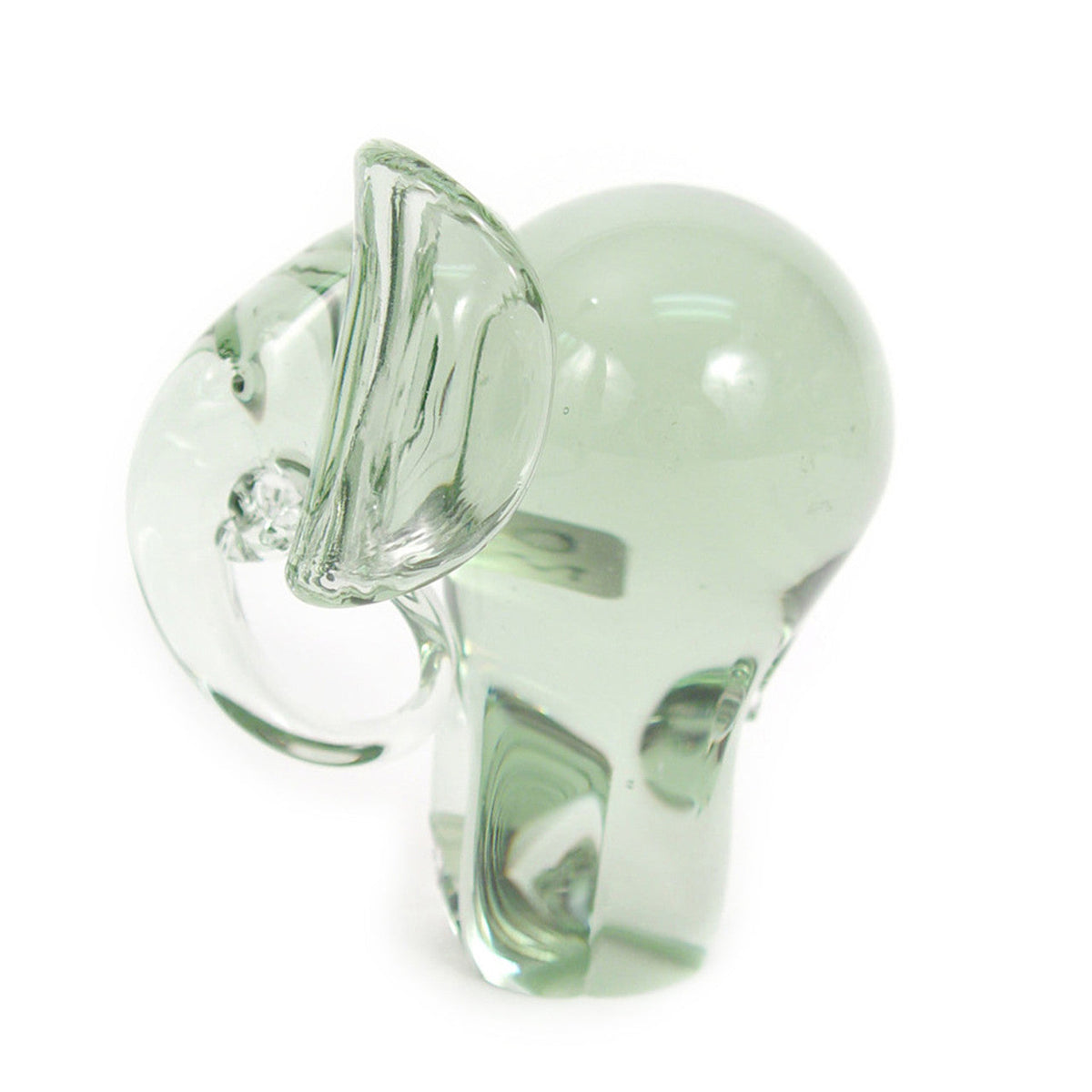 Clear green-tinted glass elephant figurine, side view with raised ear