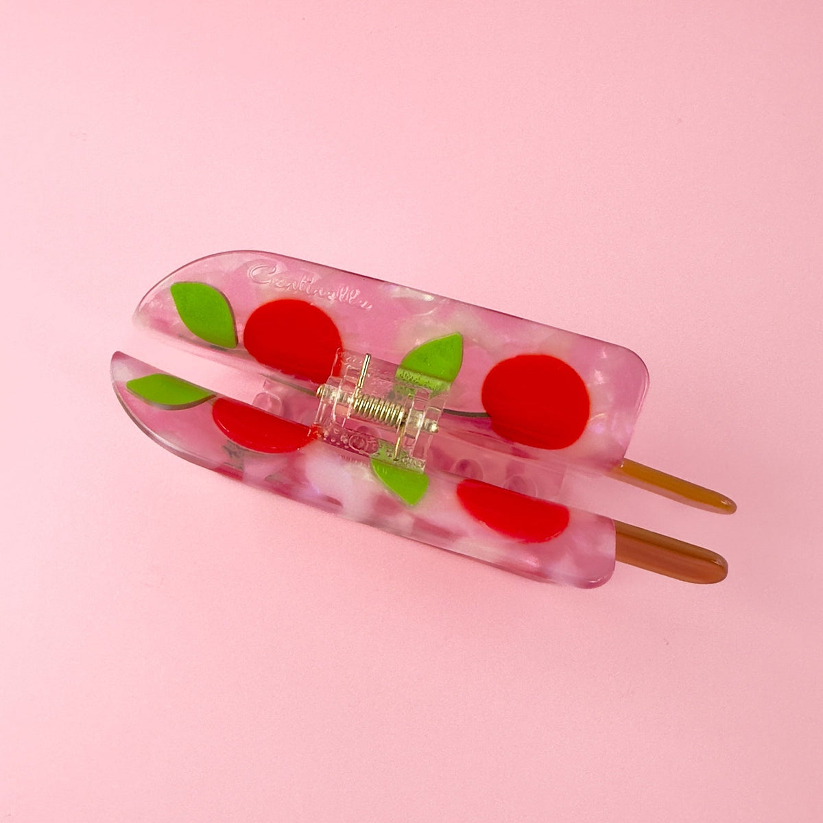 Cherry popsicle hair claw with red cherry graphics, green leaves, and metal hinge detail