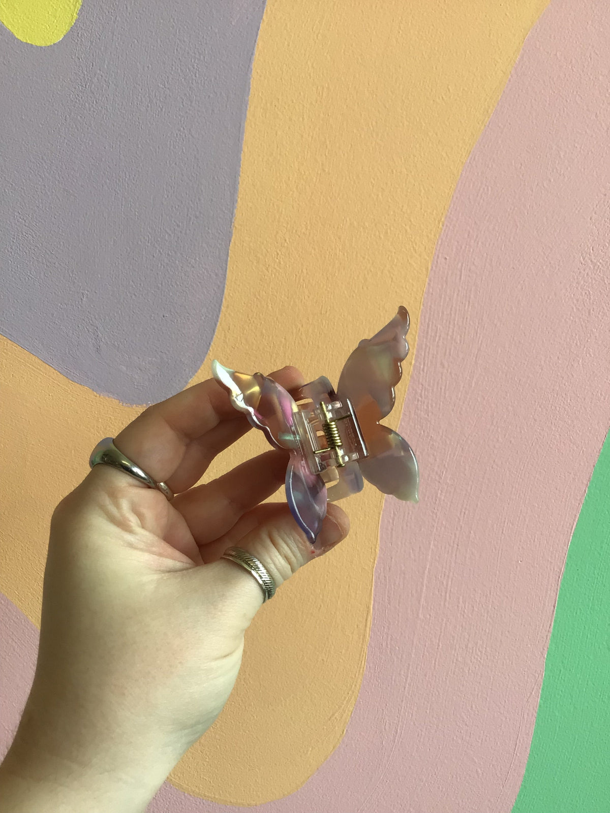 Butterfly hair claw with lavender-purple iridescent wings and metal hinged clip