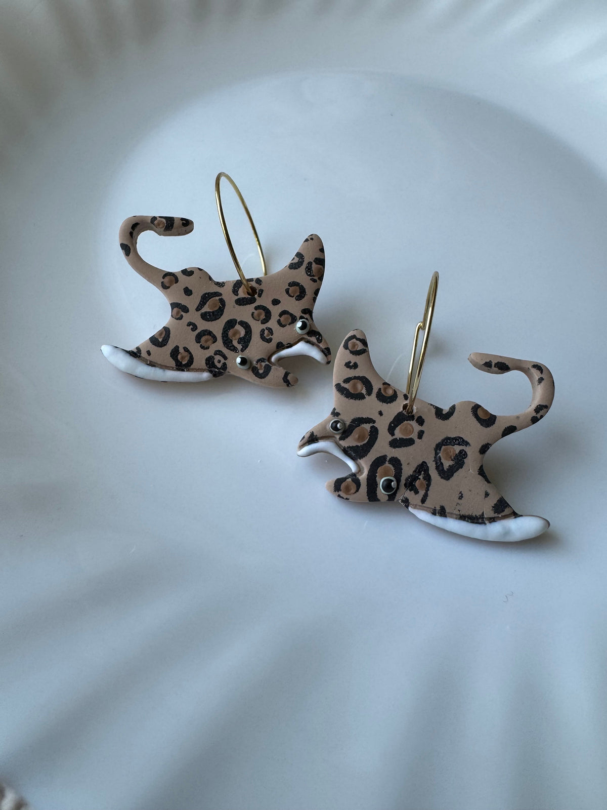 Leopard print ray dangle earrings with gold hooks