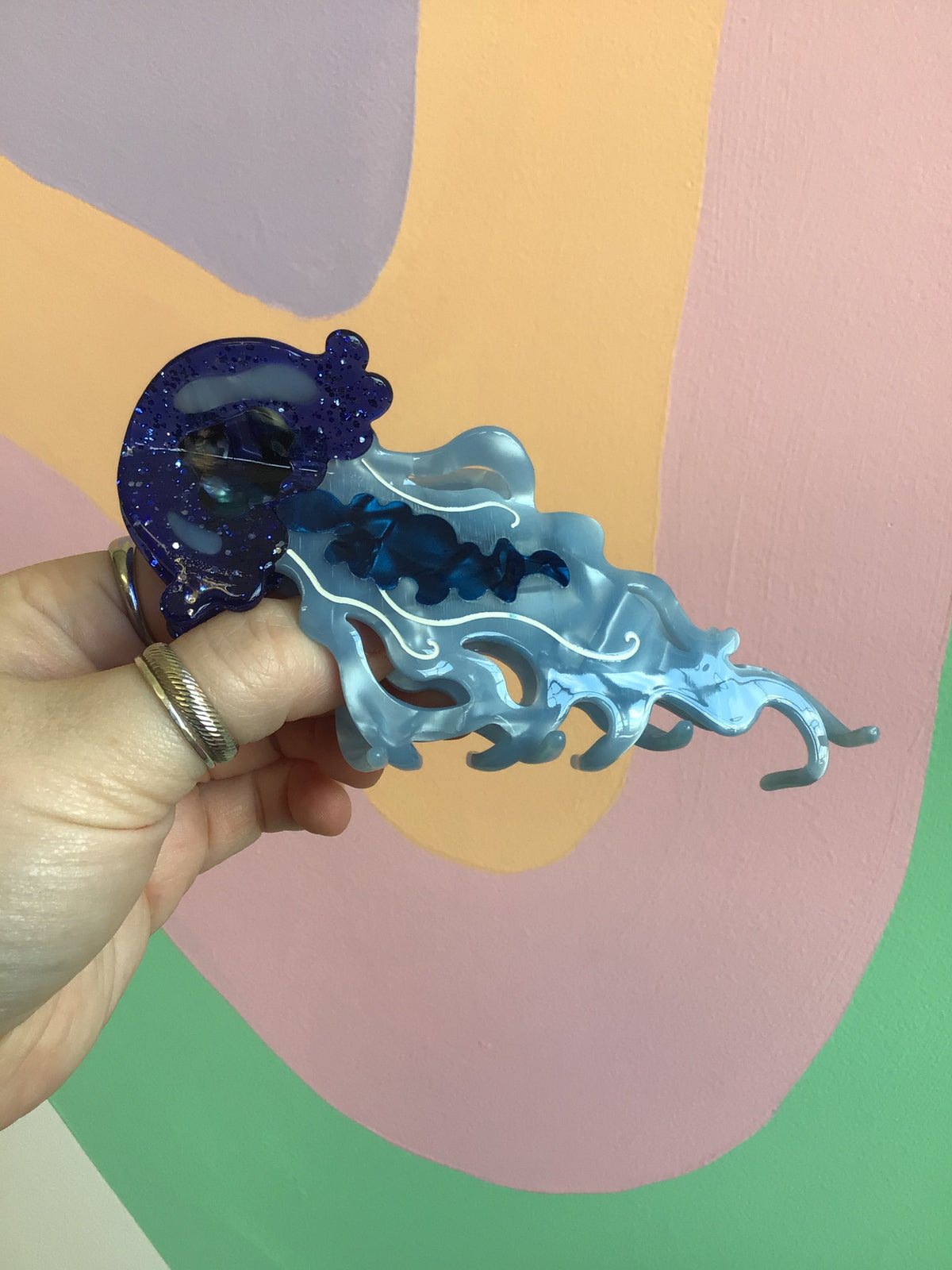 Ocean-themed hair claw with blue ocean creature design and glittery texture