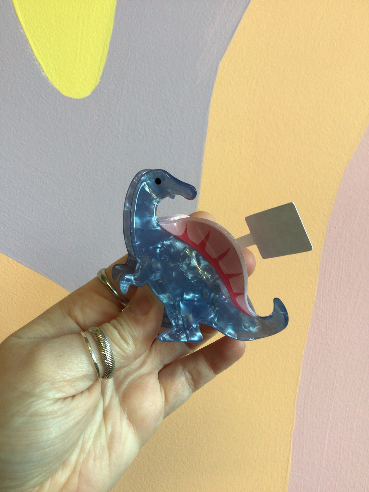 Blue dinosaur hair claw with clear acrylic claws and red interior detail