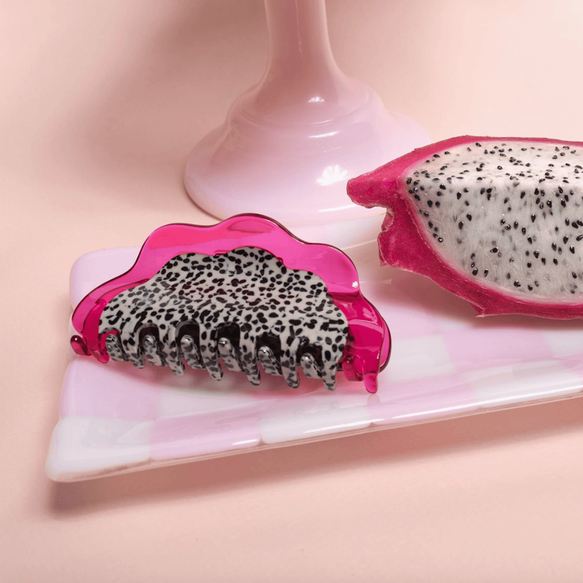 Dragon fruit hair claw with pink translucent frame and leopard-print grip teeth