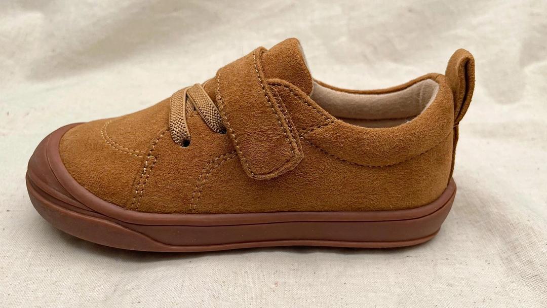 Single tan suede kids' lace-up sneaker with thick flexible rubber sole