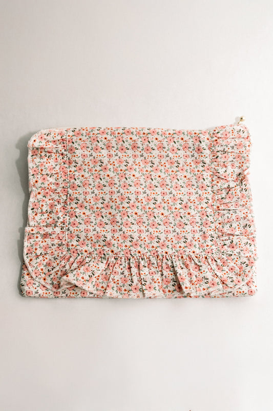 Peach floral ruffle zipper pouch with gathered front and gold zipper pull