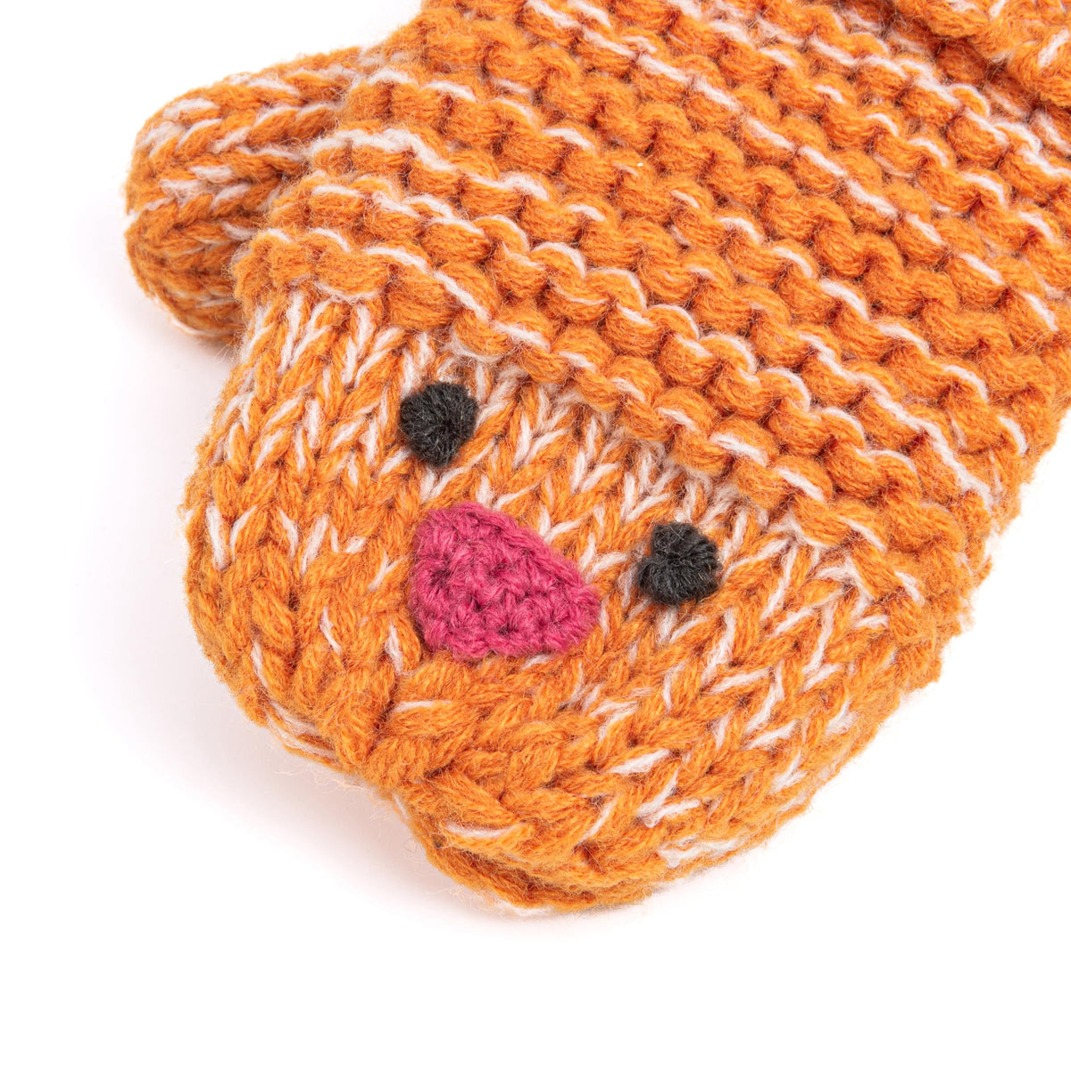 Close-up of a knitted chick mitten with black eyes and a pink beak