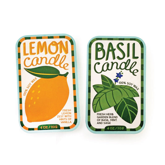 Lemon soy wax candle tin with bright orange citrus label and leaf graphic