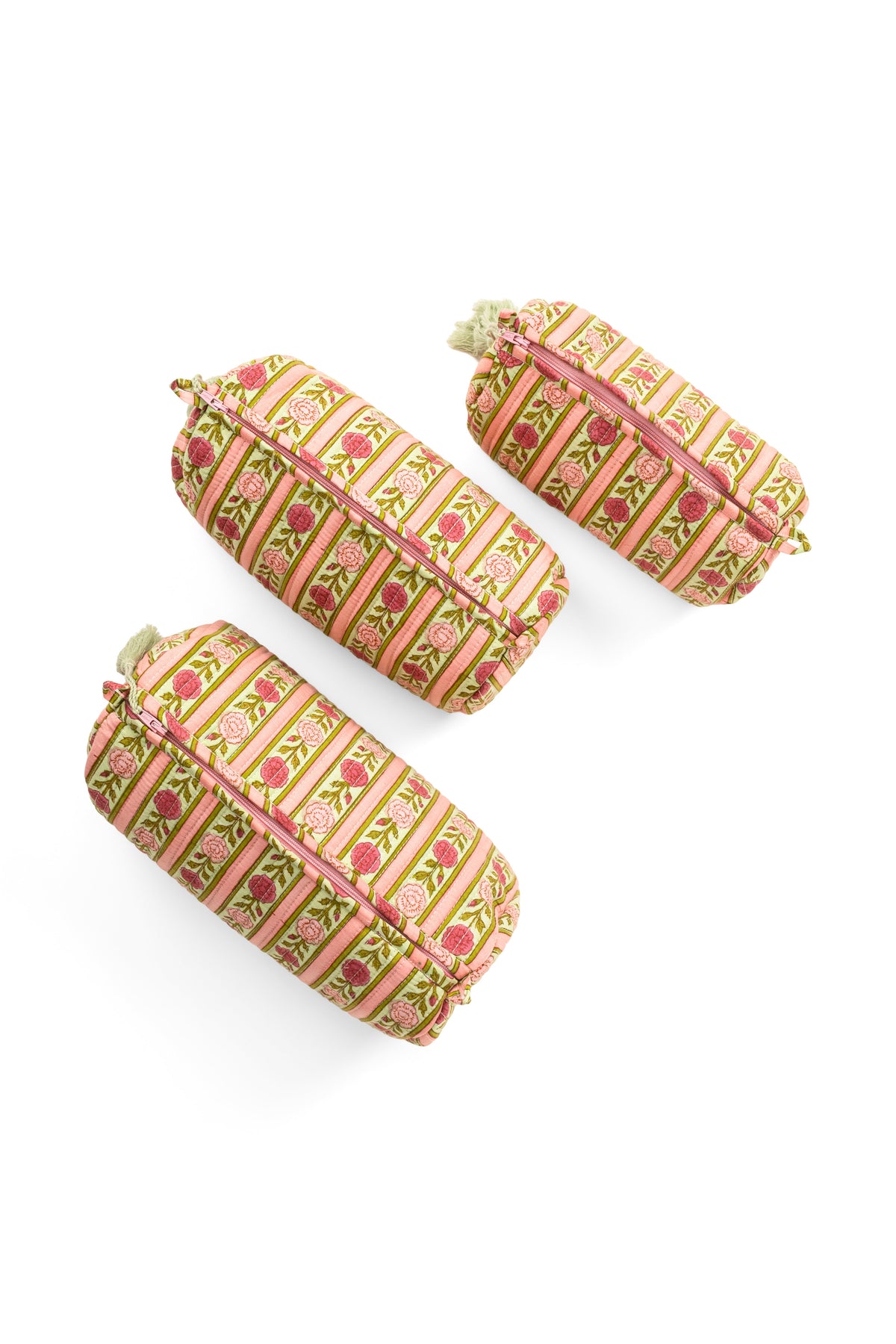 Three striped makeup pouches with tassels, zip tops in pink and green tones
