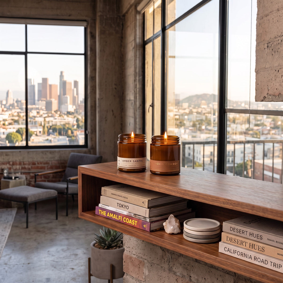Amber glass soy candle jar on a wooden shelf near windows in a living room.