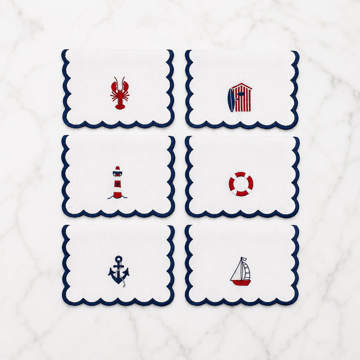 Set of 6 embroidered nautical cocktail napkins with lobster, lighthouse, anchor, ship and lifebuoy