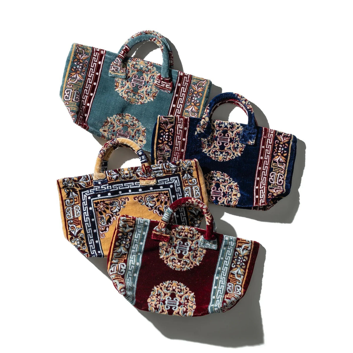 Set of patterned Persian-style tote bags in tan, teal, and burgundy tones with handles