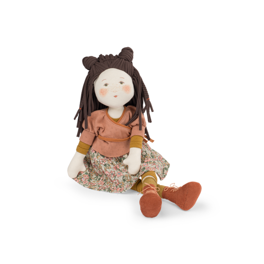 Sitting cloth rag doll with dark brown yarn hair, terracotta top, floral dress, brown boots