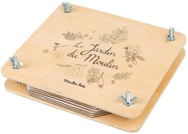 Tan botanical suitcase board with 'Le Jardin du Moulin' print and metal corner feet