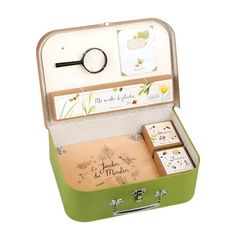 Green botanical keepsake suitcase, open with compartments and gardening cards
