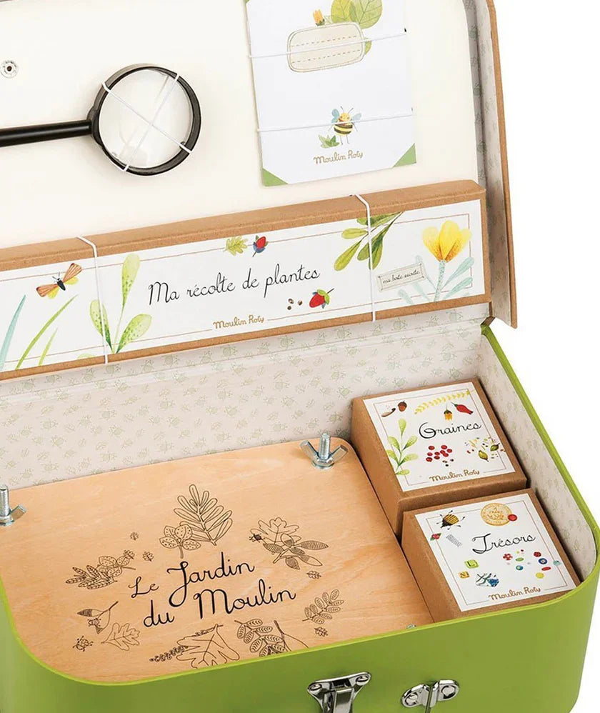 Open green botanical suitcase with front organizer and three card boxes