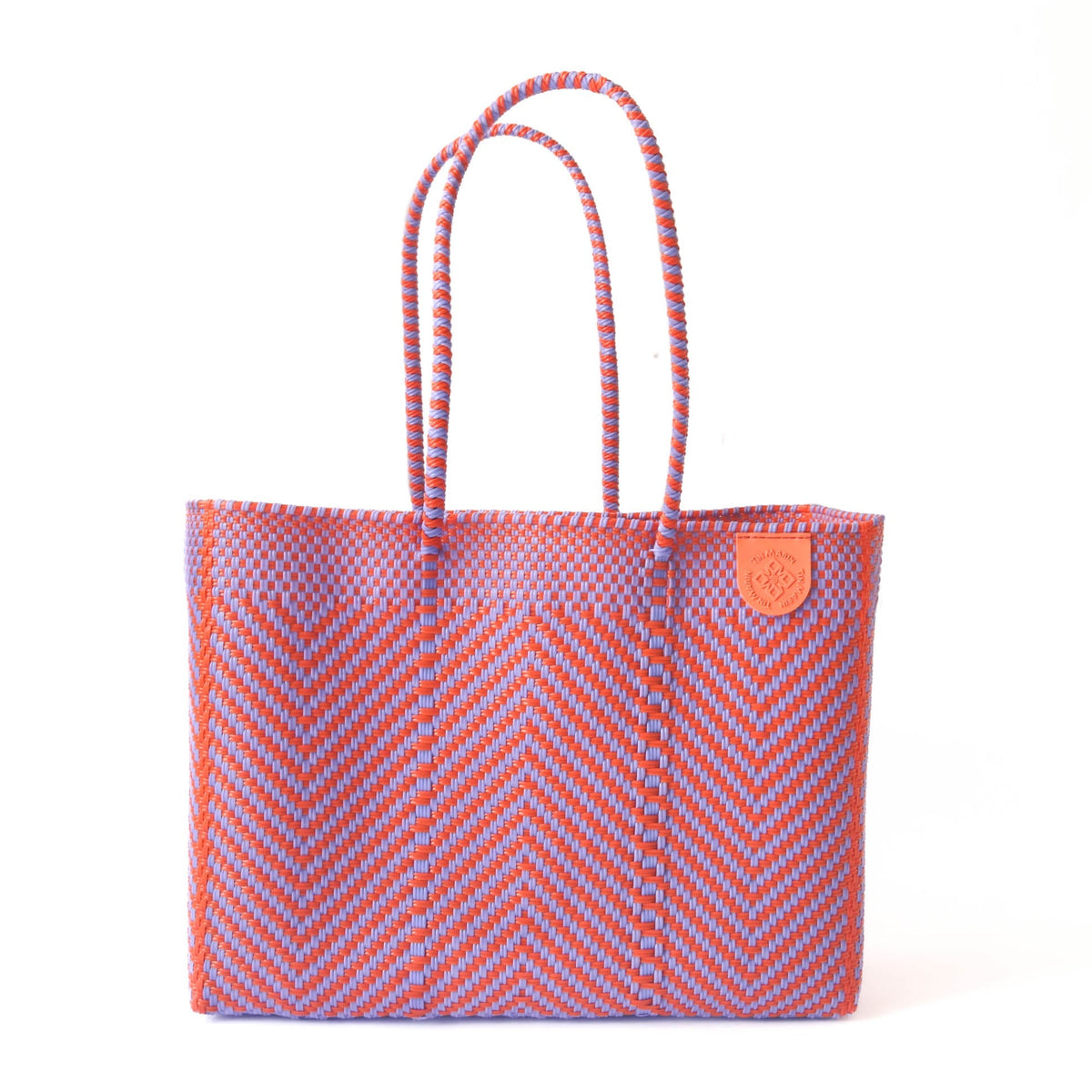 Woven chevron tote bag with braided rope handles and orange leather patch