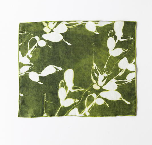 Olive green placemat with white floral vine and leaf pattern