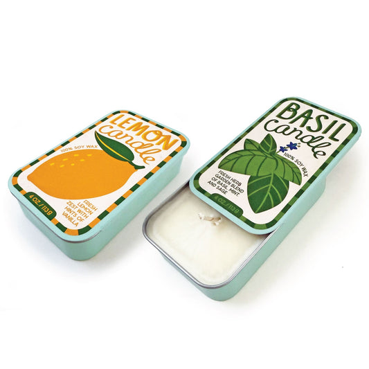 Two soy wax candle tins, lemon and basil, showing white wax and wicks