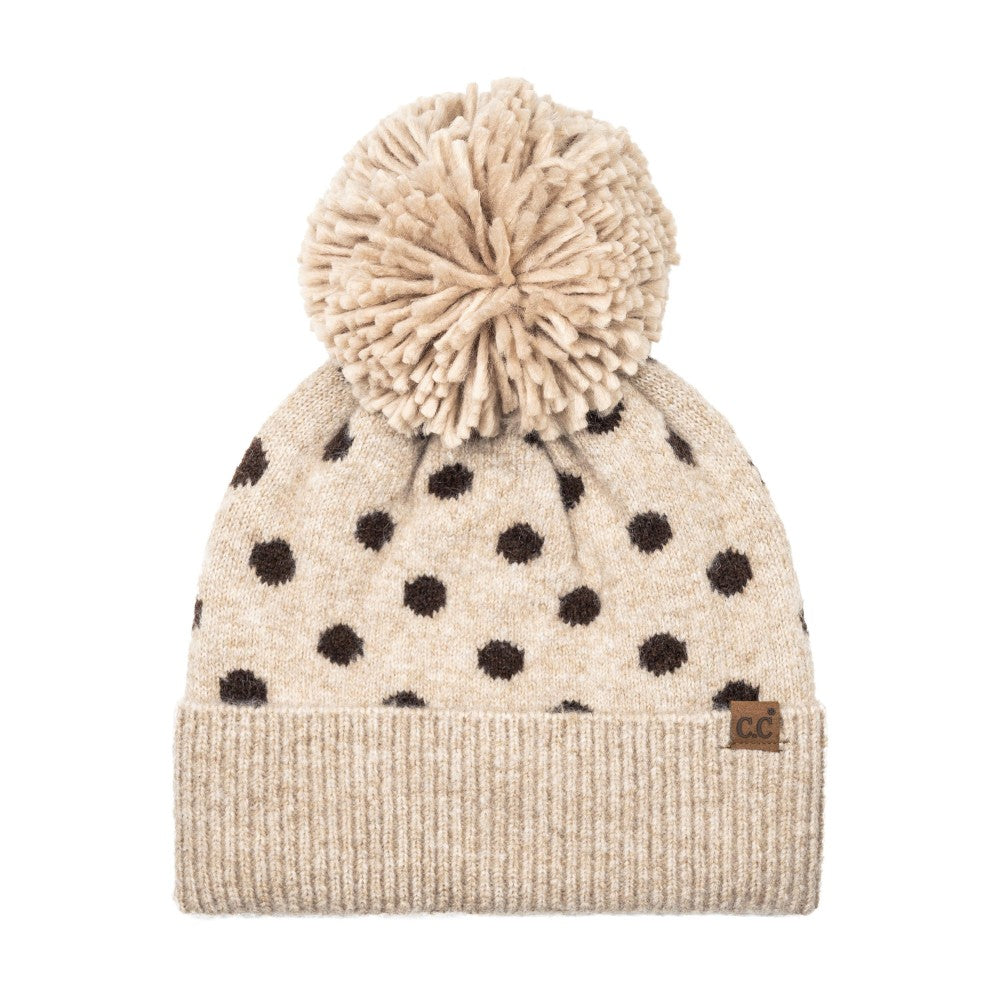 Polka dot knit beanie with taupe cuff, cream pom, and black dots