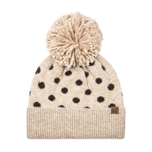 Polka dot knit beanie with taupe cuff, cream pom, and black dots