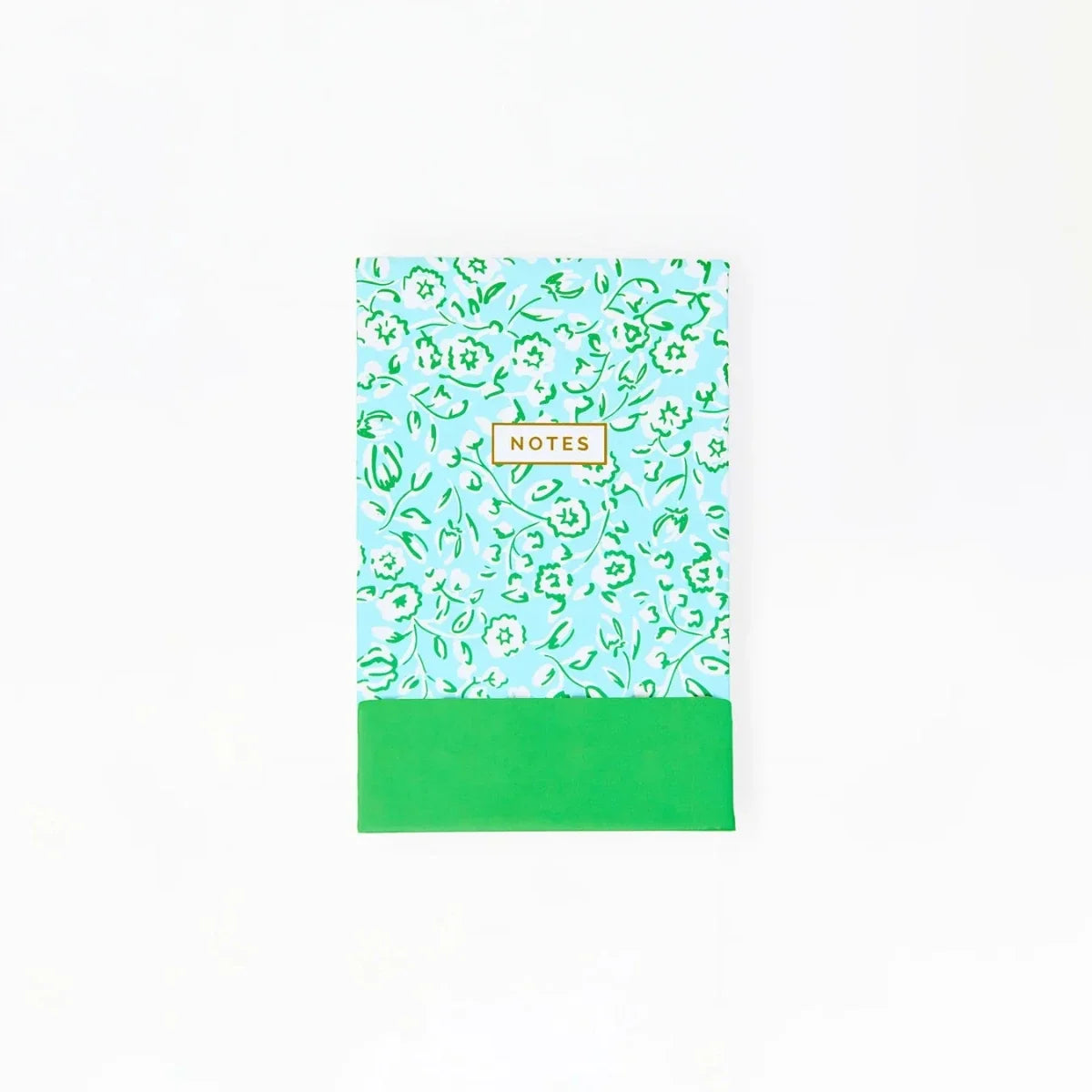 Flip notepad with green meadow-pattern cover and NOTES label
