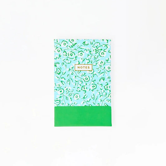 Flip notepad with green meadow-pattern cover and NOTES label
