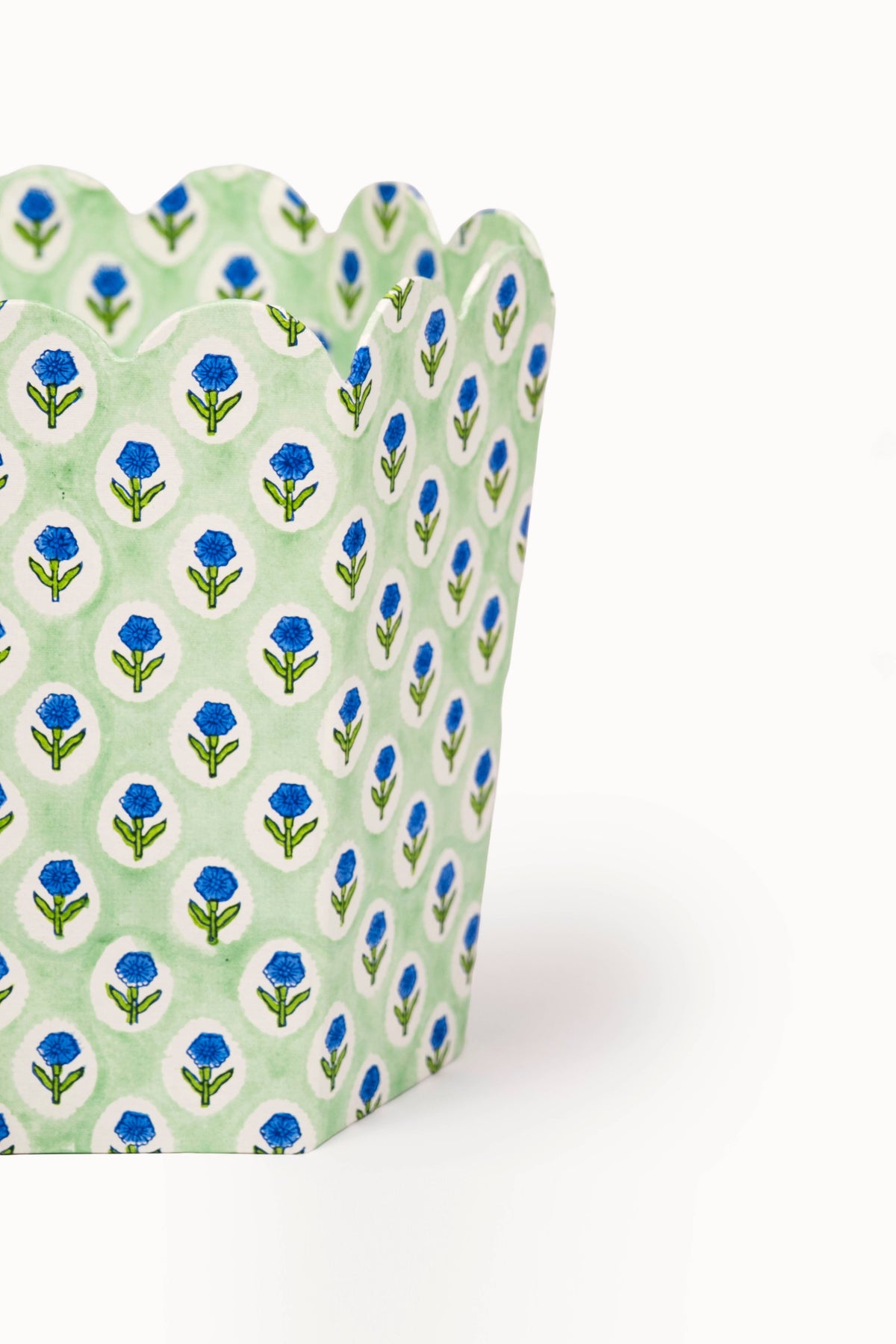Mint collapsible waste basket with blue leaf block print, close side view