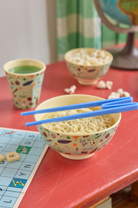 Medium kids sports-print bowl with chopsticks, soft green rim