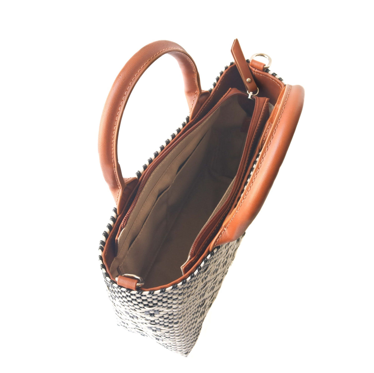 Small woven crossbody bag, black-and-white weave with tan leather trim and open top.