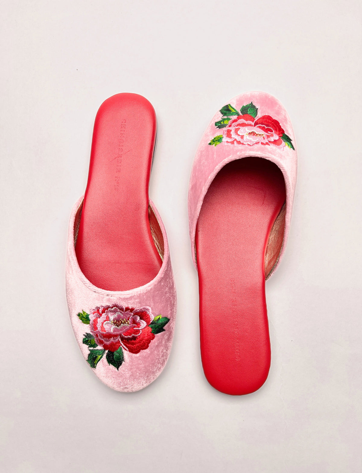 Lavender pink velvet mules with peony embroidery on the uppers, red lining and sole