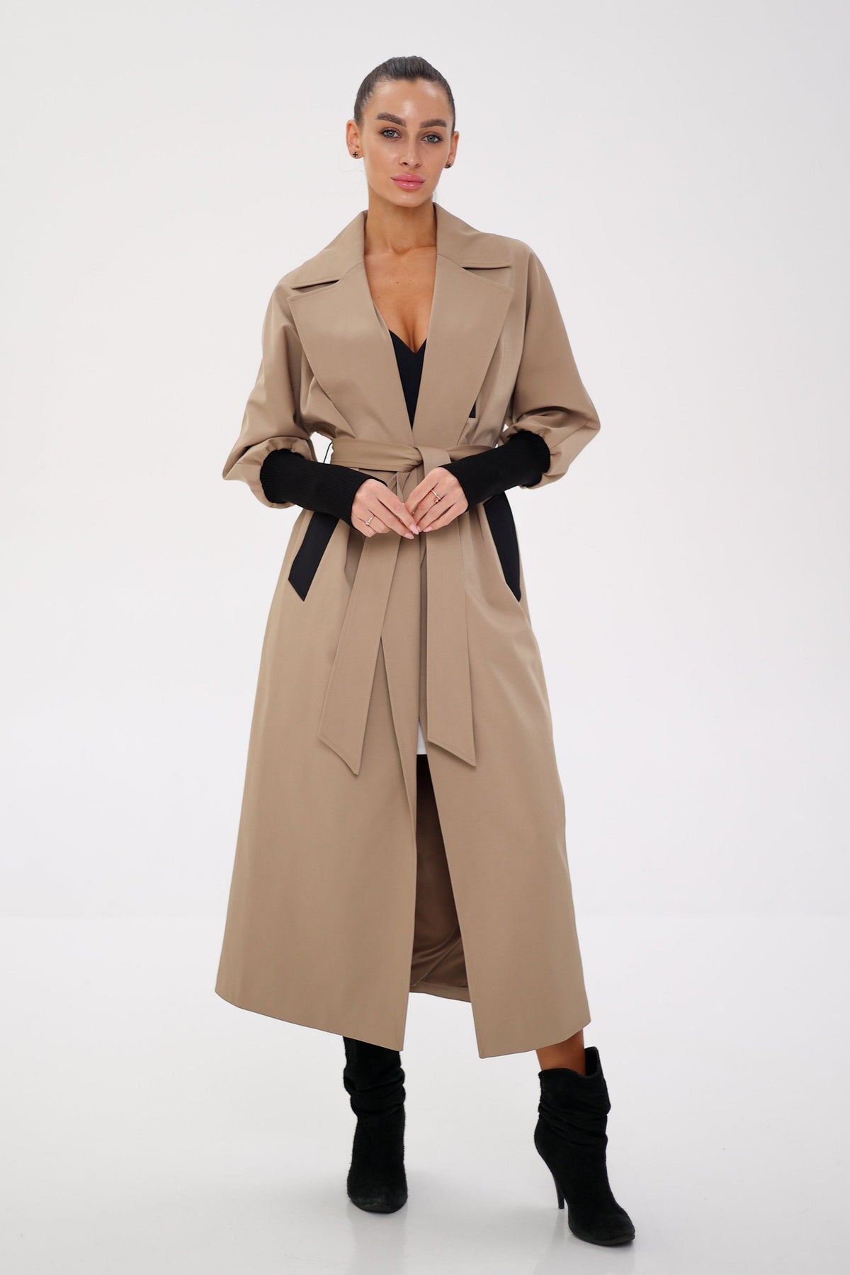 Miru camel trench coat with wide lapels, a belted waist, and gathered sleeves