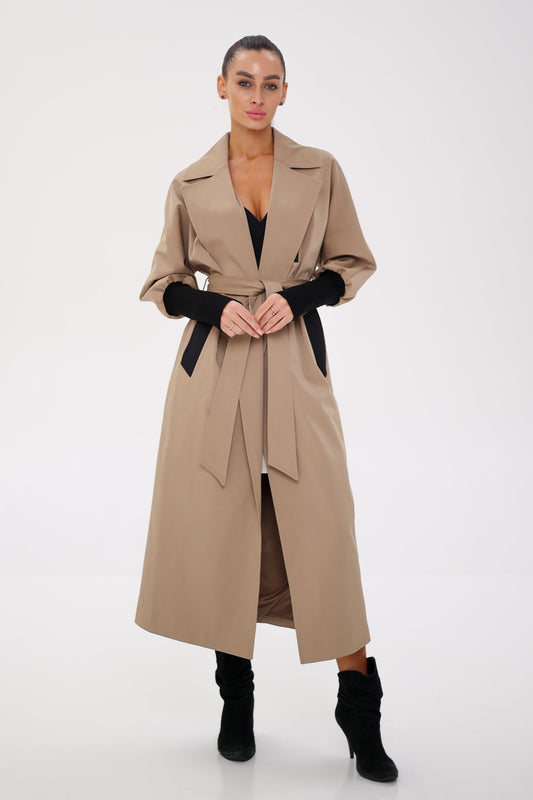 Miru camel trench coat with wide lapels, a belted waist, and gathered sleeves