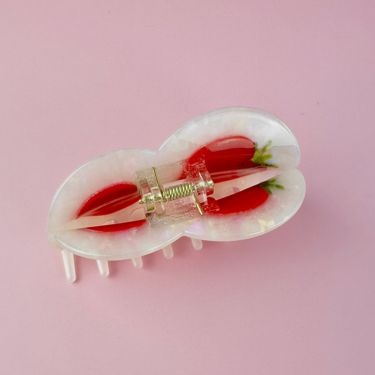 Tomato-themed hair claw clip side view with red tomato pieces and gold hinge