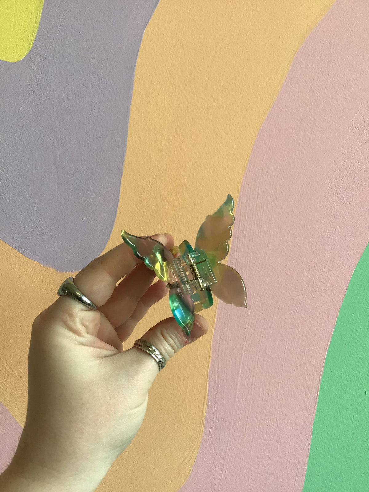 Butterfly hair claw with green iridescent wings and metal hinged clip