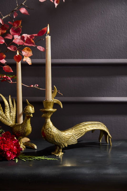 Brass pheasant candlestick with raised candle holder on bird head