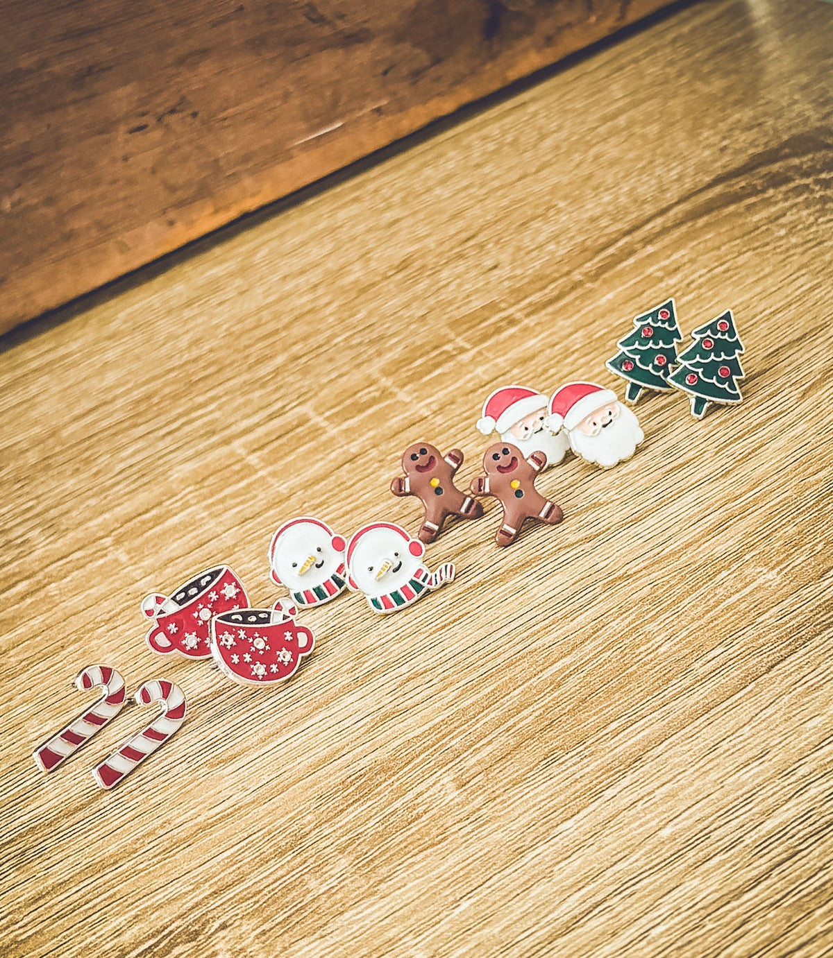 Christmas stud earring set on studs: gingerbread men, snowmen, Santa, candy cane, and tree