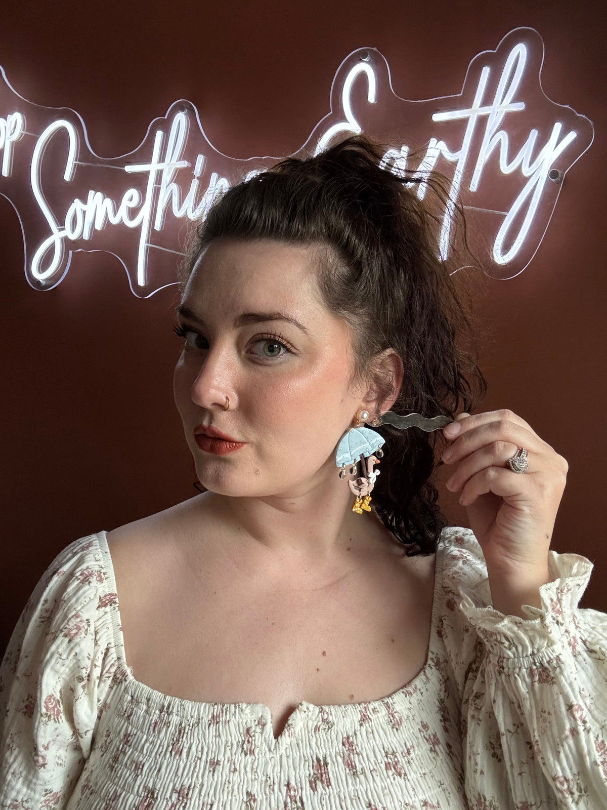Duck-shaped dangling earrings with bead raindrop charms, brown and gold accents