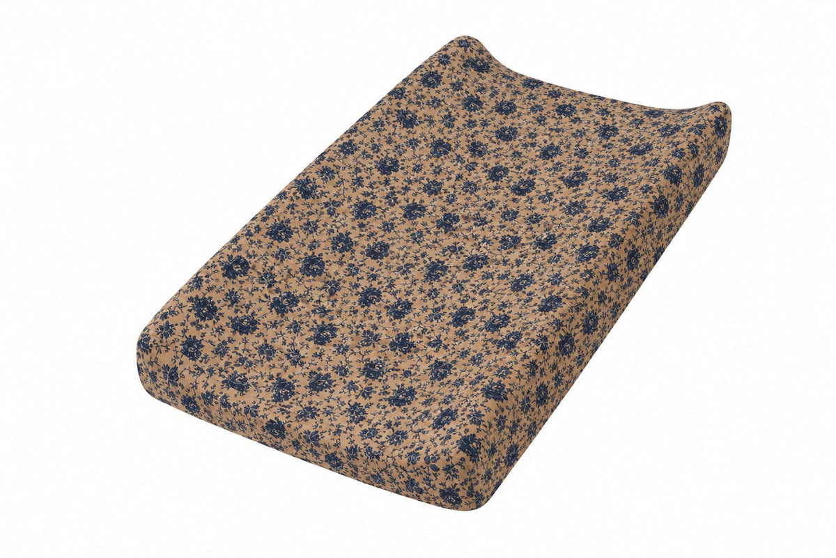 Changing pad cover with a blue and brown floral print