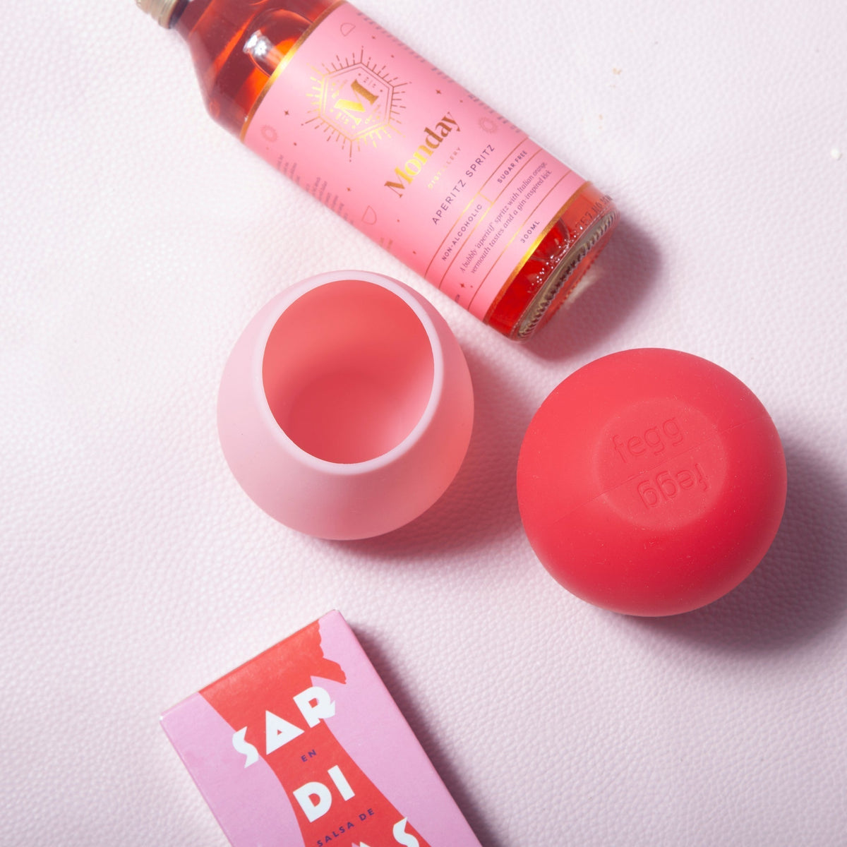 Blush pink and cherry red silicone unbreakable cups, rounded tulip shape, top view