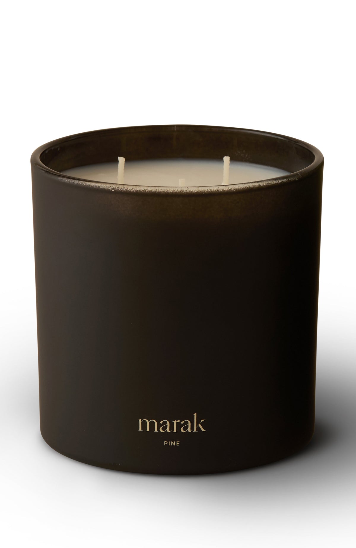 Dark scented candle jar with three white wicks and marak pine label