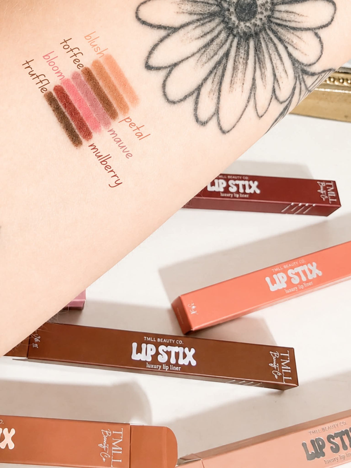 Lip liner color lineup on a swatch board with boxed liners in multiple shades.