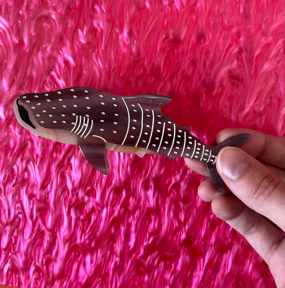 Dark brown whale-shark hair claw with white dots and striped belly