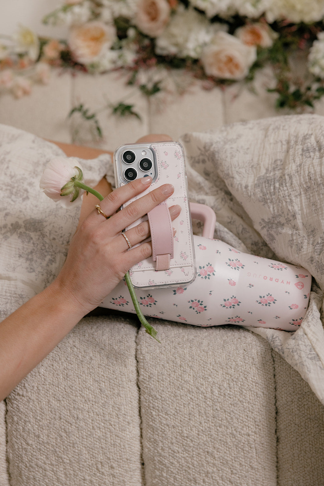 Wildrose pink floral phone case with vertical strap pocket and clear back