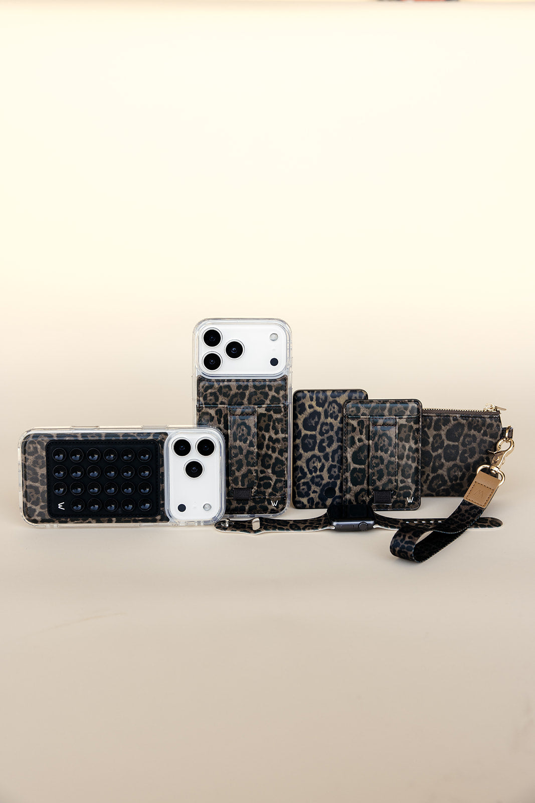 Leopard print phone cases lineup with wrist and shoulder straps
