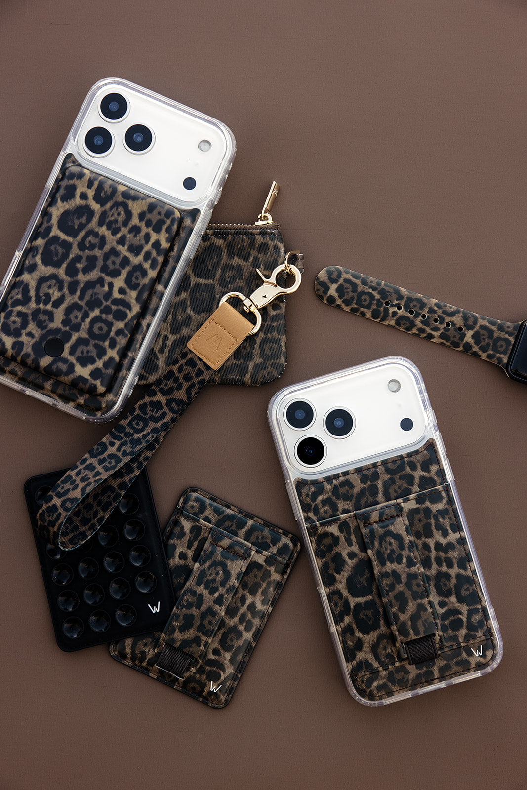 Set of leopard print phone cases with clear backs and accessory straps