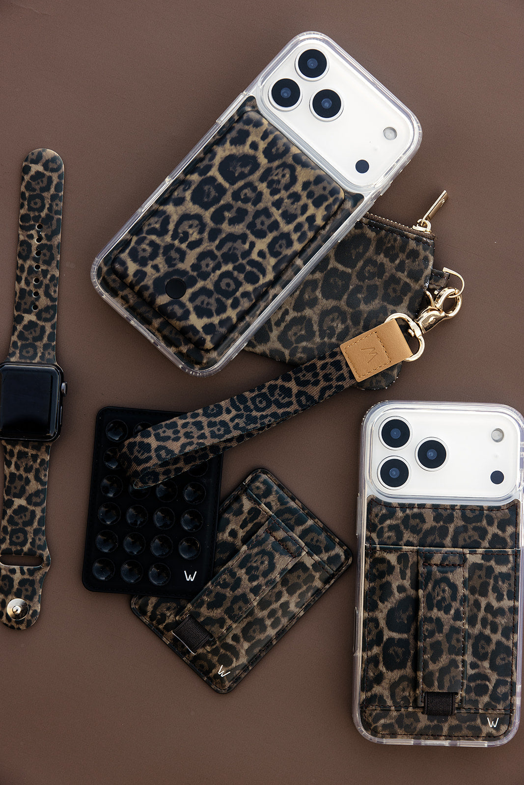 Leopard magnetic phone wallet with wrist strap and card slots, set of cases shown